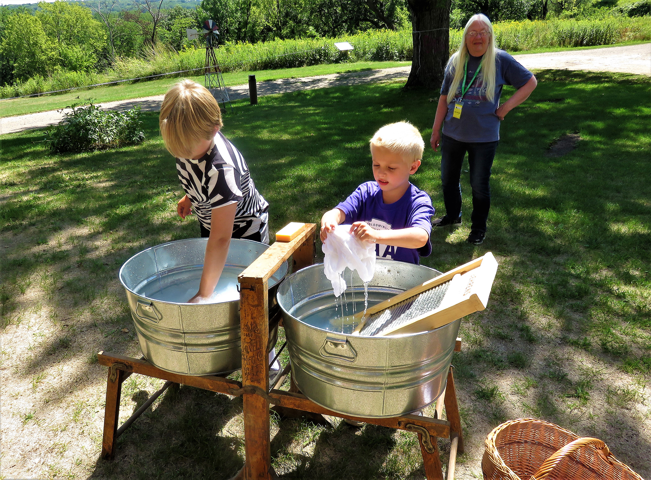 Kids doing frontier laundry at the Pond House