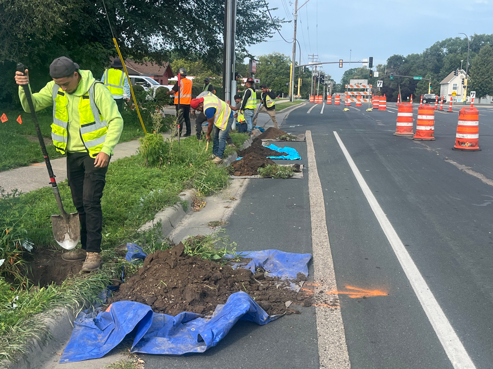 Workers installing fiber-optics