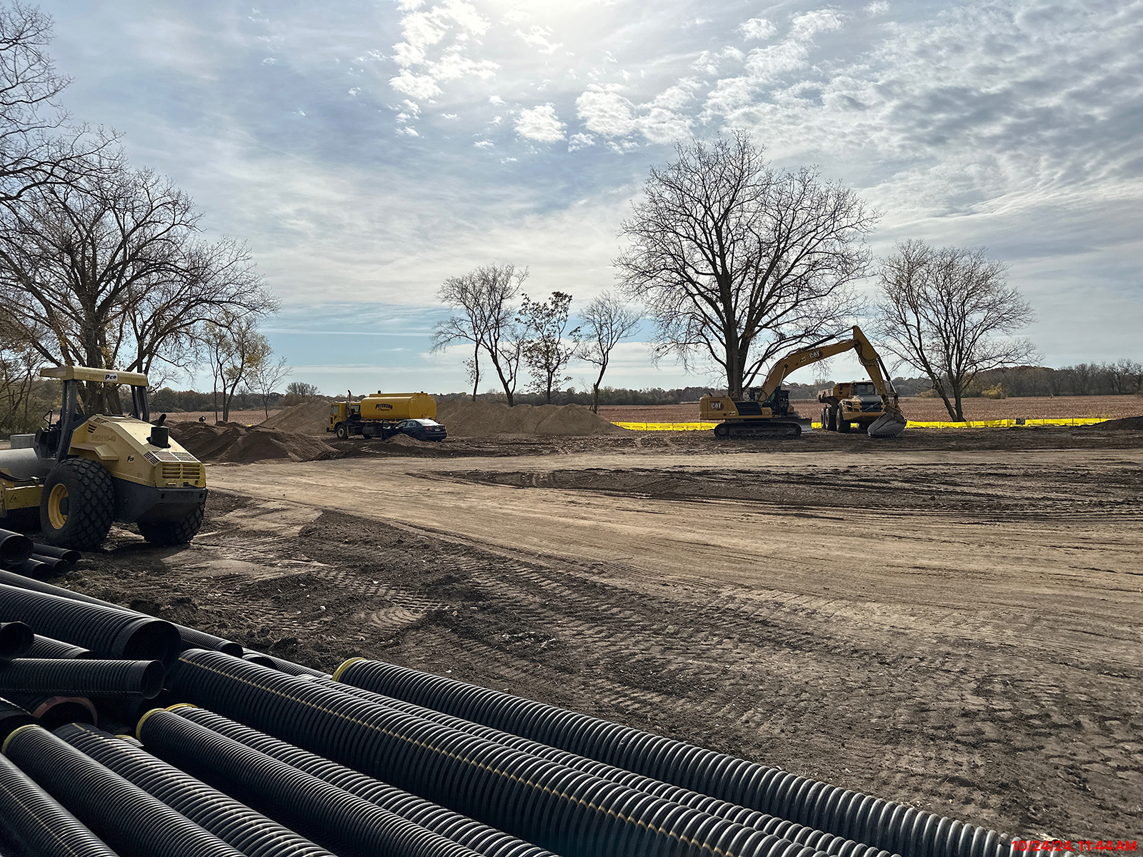 Heavy equipment moving dirt during construction of Tretbaugh Park October 2024