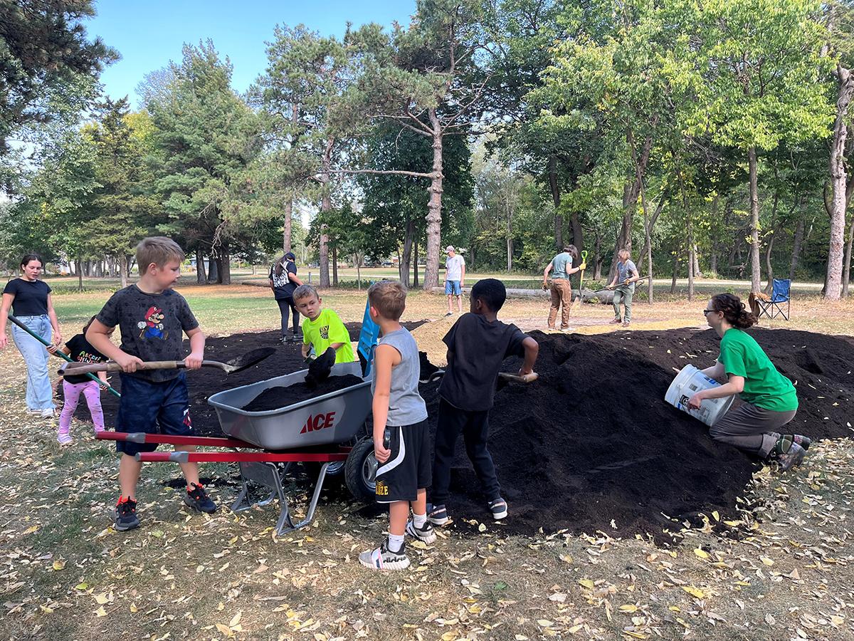 Kid Volunteers helping prepare the Indigenous garden