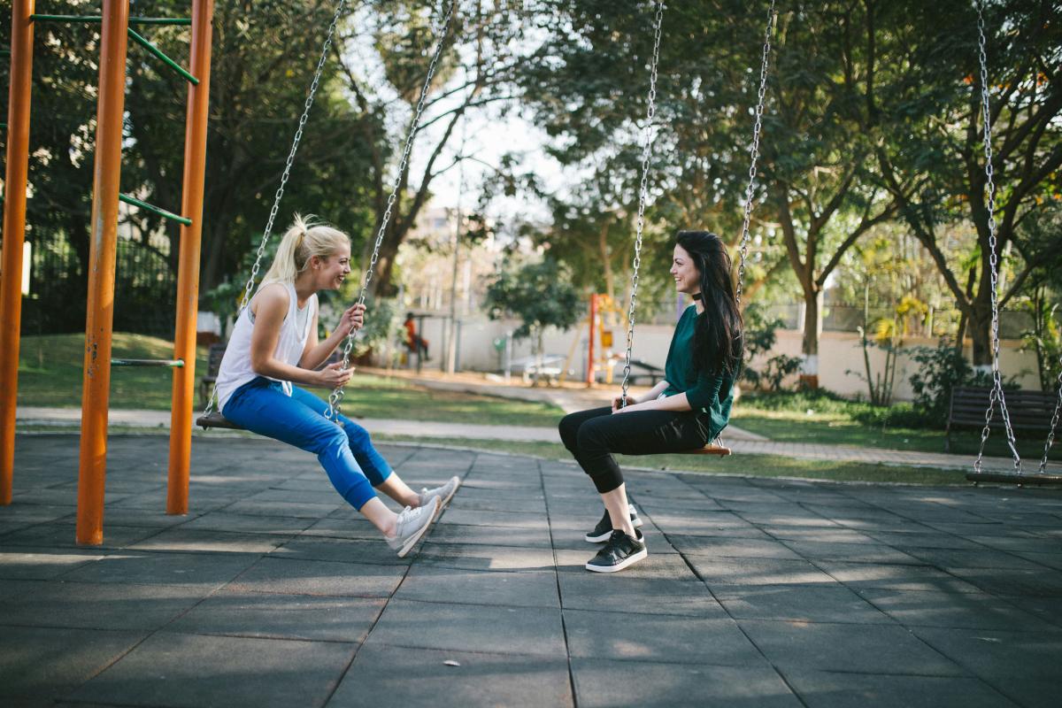 women on swings