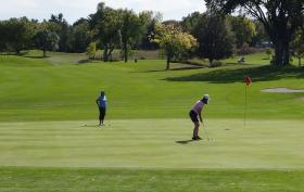 Women golfing on hole 9 at Dwan Golf Course